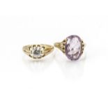 A 9ct gold amethyst dress ring, oval mixed cut centre stone in claw setting, ring size W, and a