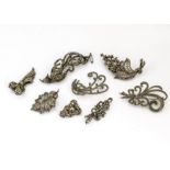 A collection of eight silver marcasite brooches, including an exotic bird example, a bow clip, and