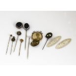 A small quantity of gold, silver and base metal stick pins and buttons, including two Dorsetshire