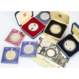 A collection of British crowns, including a silver proof 1977 crown, 80th Queen Mother crown and a