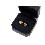 A pair of Chopard heart shaped Happy Diamond earrings, the ear studs set with three floating