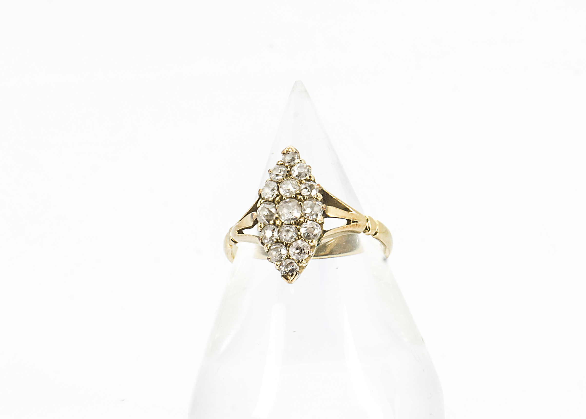 A 19th Century 18ct gold diamond dress ring, the navette shaped setting encrusted with old cut