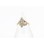 A 19th Century 18ct gold diamond dress ring, the navette shaped setting encrusted with old cut