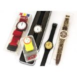 Three Swatch watches, including a black A83, strap damaged, another in box marked S446, and a Pop