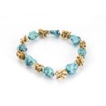 A continental yellow metal and turquoise bracelet, the turquoise matrix beads alternately set with