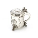 An 18th century Norwegian silver tankard, three lion and ball supports with raised and engraved