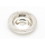 A 1970s silver dish by Gerald Benney, circular having bark effect textured rim and engraved grape