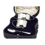 A cased George V silver three piece christening set by Alexander Clark, with feeding bowl, mug and