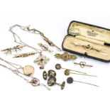 A quantity of gold brooches, one cased, including a 15ct gold sapphire and seed pearl bar brooch