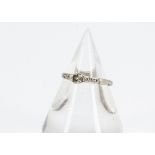 A platinum diamond set solitaire ring, the brilliant cut in claw setting with diamond set