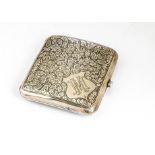 A George V silver cigarette case, square with engraved scrolling foliage