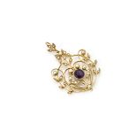 An Edwardian amethyst and seed pearl yellow metal set art nouveau pendant, of oval, floral design,