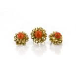 A continental suite of 14K yellow metal and coral jewels, comprising a ring and pair of clip