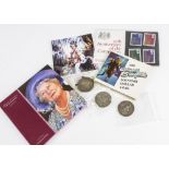 A small collection of coins and stamps, including a George III and Victorian crown, worn, a 1935 and