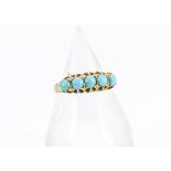 A George V 18ct gold turquoise dress ring, the five claw set cabochons in yellow god setting and