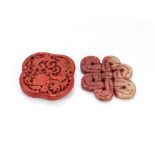 A Chinese cinnabar lacquer ogee formed pendant, the red engraved body decorated with flora and