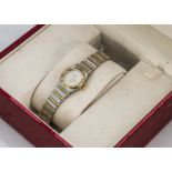 A 1990s Omega Constellation lady's stainless steel and gilt wristwatch, 24mm case with gilt bezel