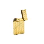 A gilt metal Dupont pocket lighter, with textured geometric pattern, stamped and numbered to base