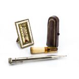 An amber and meerschaum cheroot holder, in fitted leather case, an EDAC Paris silver plated