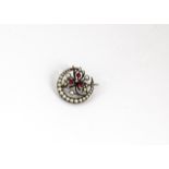 An early 20th Century continental white metal, red paste and simulated pearl crescent brooch, with