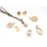 A collection of Chinese gold charms, together with a pair of Chinese character ear studs, a