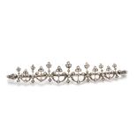 A 19th Century converted diamond set brooch, the stylised flower heads in crescents in alternate