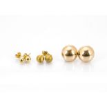 A pair of 14ct marked gold studs, a pair of textured spherical studs and another pair, total