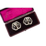 A pair of Victorian paste set buckles, the floral and crescent moon design within an ogee frame, set