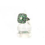 An art deco style diamond, emerald and sapphire dress ring, old cut diamond centred within an