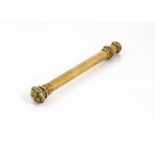 A Victorian gold retractable pencil, with engine turned body, possibly 15ct or 18ct gold, chased