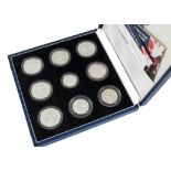 A Royal Mint collection of nine silver proof like WWII commemorative coins, in a case, with