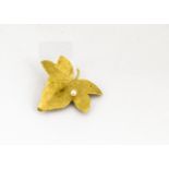 A continental yellow metal 750 marked maple leaf and cultured pearl brooch, the naturalistic leaf