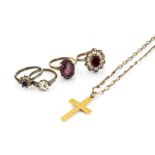 An amethyst paste set dress ring, three other paste set rings, a 9ct gold cross and gilt metal chain