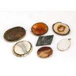 Seven hardstone silver and gilt metal mounted brooches, including bloodstone, agate, and blue jasper