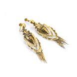 A pair of Victorian yellow metal earrings, the oval filigree central drop having hinged reversed