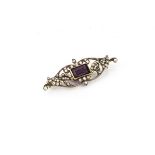 An amethyst and diamond belle epoque brooch, the rectangular cut central amethyst surrounded by