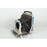 A Musashino Koki 5 x 4in Rittreck View Camera, P, no lens, bellows badly split, rear viewing