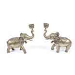 A pair of late 19th Century Anglo Indian cast brass candlesticks, modelled as elephants with