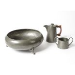 Three items of 20th Century Sheffield hand hammered pewter, consisting of a jug, height 13 cm,