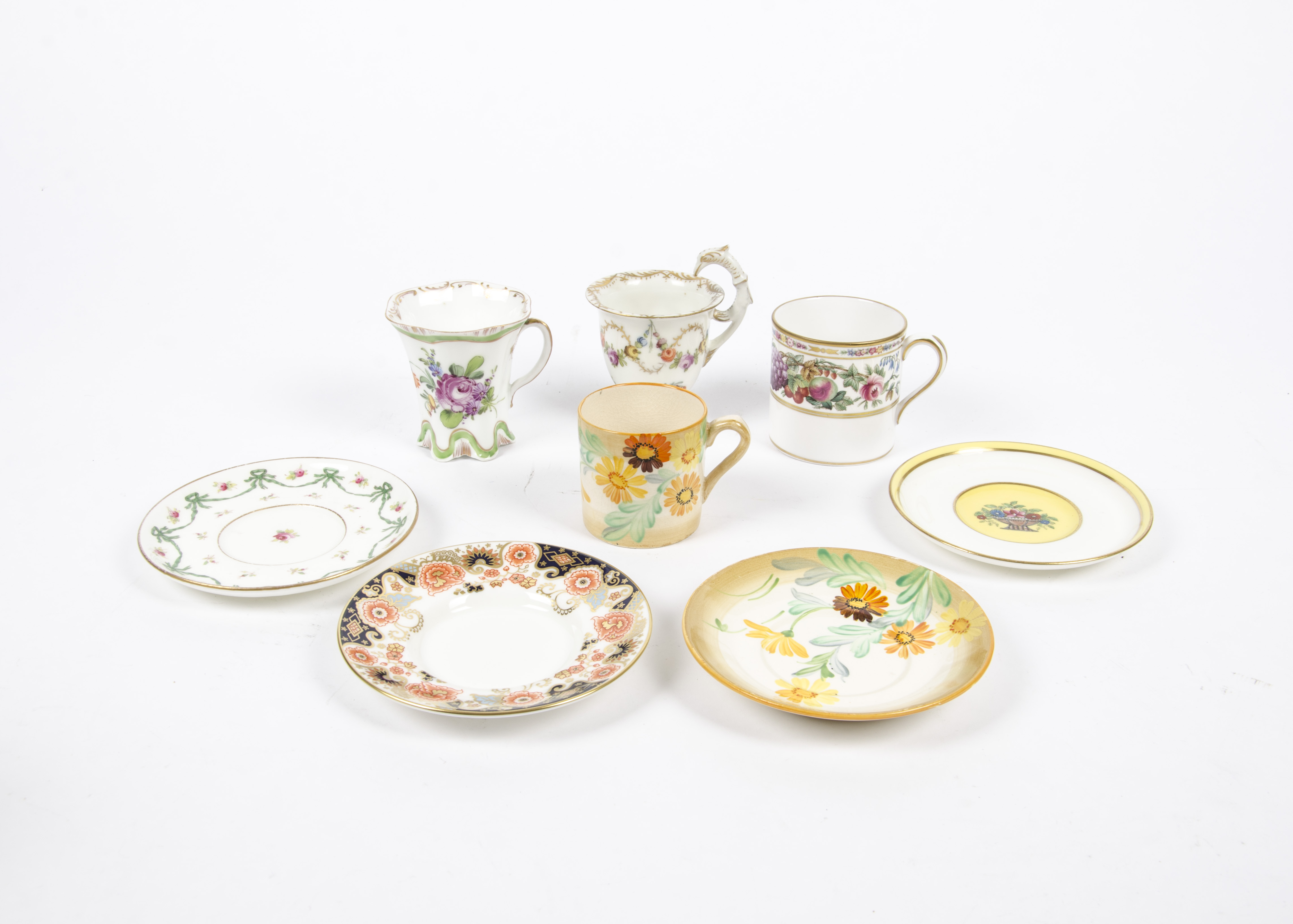 A collection of cabinet cups and saucers, all highly decorated, attractive examples to include a