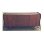 A Mid 20th Century A. Younger Ltd. teak sideboard, a label to the inside door, with four long