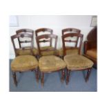 A set of six 19th Century walnut dining chairs, with turned front supports, upholstered with gold