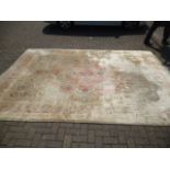 A large Chinese silk carpet, having cream ground with floral decoration, AF, 273 cm x 372 cm faded