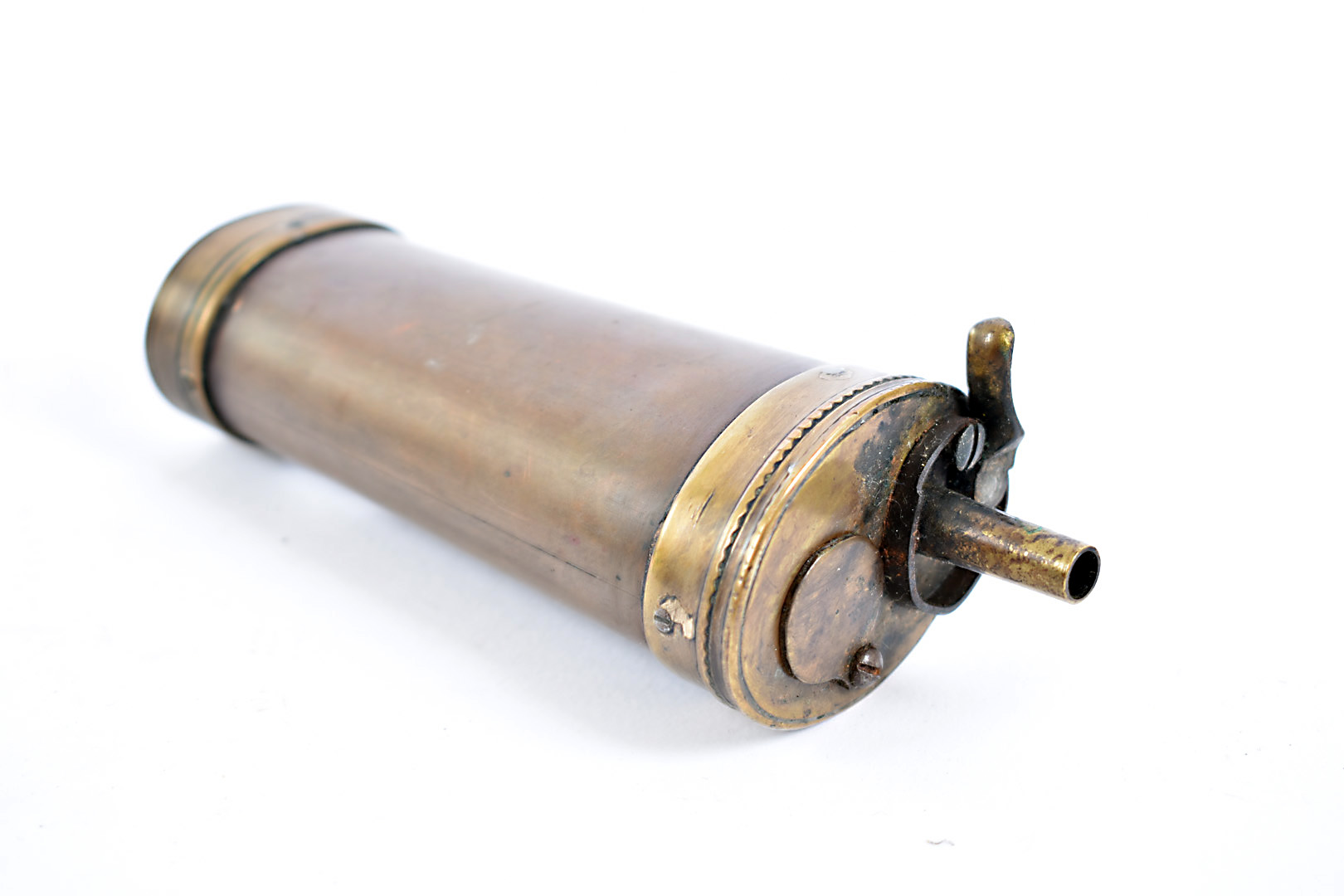 A vintage French brass and copper powder flask, the unmarked flash of oval cylindrical form, 15cm in