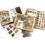 A collection of stamps and coins and toy figures, including a small swops pocket stockbook, a