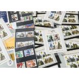 A collection of pre and post decimal mint stamps, in presentation packs, booklets and miniature