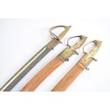 Three reproduction Indian talwars, each having curved blades, with etched design, all with scabbards