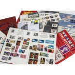 A collection of stamps, mostly in schoolboy albums, and some loose, a few mint examples and FDCs