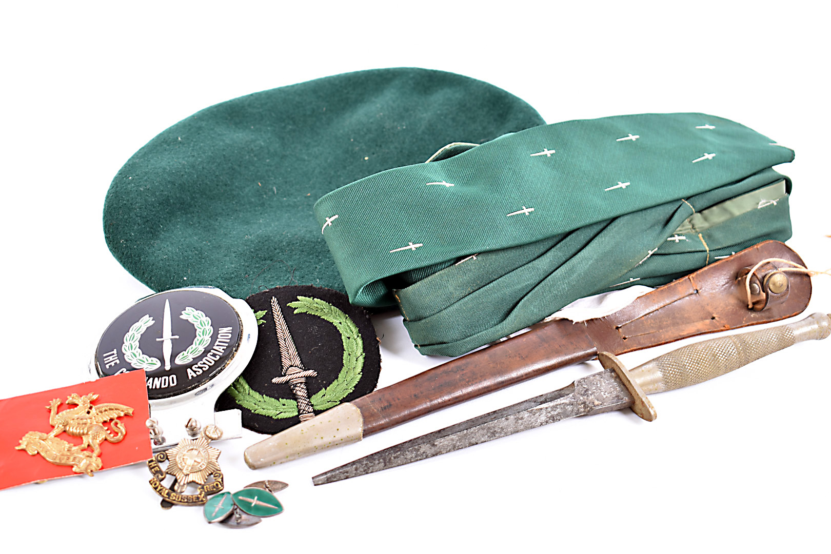 A collection of Commando related items, to include a Wilkinson Fairbairn Sykes dagger and