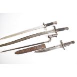 A Ross Mk2 with scabbard, together with an 1856 pattern yataghan, a Martini socket bayonet by R &